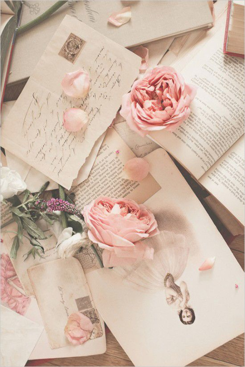 Paper, Note and Flower on the Table